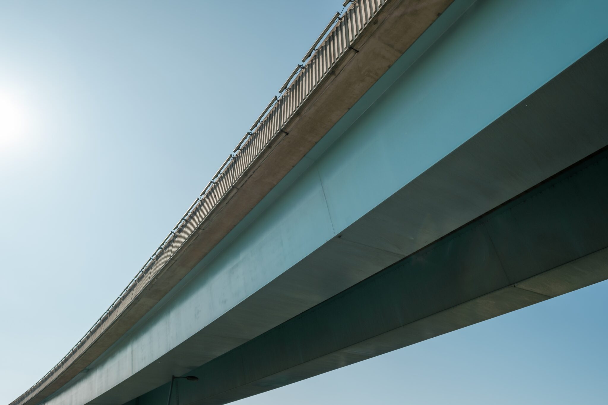 A,Curved,Motorway,Or,Freeway,Overpass,With,A,Blue,Sky